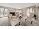 Bright living room with a cozy fireplace, French doors, and comfortable seating arrangement at , Stone Mountain, GA 30088