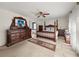 Main bedroom featuring a canopy bed, dressers, carpet and windows with sheer curtains at , Stone Mountain, GA 30088