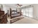Main bedroom featuring a canopy bed, ceiling fan, carpet and large windows with sheer curtains at , Stone Mountain, GA 30088