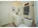 Charming bathroom with tile flooring, a framed mirror, and a white cabinet at 2557 Staunton Dr, Duluth, GA 30097