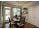 Cozy breakfast nook featuring an oversized window, patio door, and decorative 'gather' wall art at 2557 Staunton Dr, Duluth, GA 30097