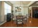 Cozy dining area with hardwood floors, large window and elegant decor at 2557 Staunton Dr, Duluth, GA 30097