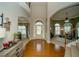 Elegant foyer with hardwood floors, arched doorways, and access to adjacent living spaces at 2557 Staunton Dr, Duluth, GA 30097