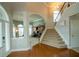 Elegant foyer with staircase and hardwood floors showcasing an open layout at 2557 Staunton Dr, Duluth, GA 30097