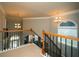 Upstairs landing boasts iron railings, high ceilings, and natural light from the arched windows at 2557 Staunton Dr, Duluth, GA 30097