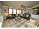 Comfortable living room showcasing large windows and plush leather sofas at 2557 Staunton Dr, Duluth, GA 30097