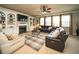 Cozy living room with a fireplace, built-in shelves, and a comfortable seating area at 2557 Staunton Dr, Duluth, GA 30097