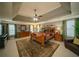 Spacious main bedroom featuring tray ceilings, large windows, and a ceiling fan at 2557 Staunton Dr, Duluth, GA 30097