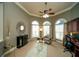 Bright home office with large arched windows, built-in cabinets, and ample workspace at 2557 Staunton Dr, Duluth, GA 30097