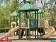 Community playground with slides, climbing structures, and shaded areas at 2557 Staunton Dr, Duluth, GA 30097