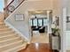 Carpeted staircase leads to an open living area with hardwood floors and a modern decor at 2557 Staunton Dr, Duluth, GA 30097