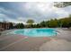 Large community swimming pool with lounge chairs and well-maintained deck at 2557 Staunton Dr, Duluth, GA 30097