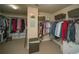 Spacious walk-in closet with ample shelving, hanging rods, and built-in storage solutions for organization at 2557 Staunton Dr, Duluth, GA 30097