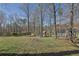 Spacious backyard featuring a play set, promising outdoor fun for children at 525 Penny Ln, Woodstock, GA 30188