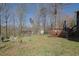 Lush backyard featuring a play set, deck, and ample space for outdoor enjoyment at 525 Penny Ln, Woodstock, GA 30188