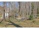 Wooded backyard with a relaxing hammock, perfect for enjoying the surrounding nature at 525 Penny Ln, Woodstock, GA 30188