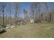 The spacious backyard offers privacy and includes a play set for children at 525 Penny Ln, Woodstock, GA 30188