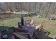 Spacious backyard featuring a large deck, pool, and playground at 525 Penny Ln, Woodstock, GA 30188