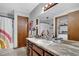 Charming bathroom featuring a vanity with marble countertop and ample storage space, creating a relaxing space at 525 Penny Ln, Woodstock, GA 30188
