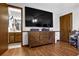 Bedroom featuring hardwood floors, a television, closet, and access to the bathroom at 525 Penny Ln, Woodstock, GA 30188