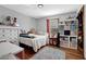 Cozy bedroom featuring a large bed, ample natural light, and storage options, ideal for rest and relaxation at 525 Penny Ln, Woodstock, GA 30188