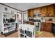 Spacious kitchen showcasing wooden cabinets, modern appliances, and functional island, great for Gathering gatherings at 525 Penny Ln, Woodstock, GA 30188
