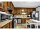 Cozy kitchen with ample wood cabinetry, stainless steel appliances, and functional layout perfect for cooking at 525 Penny Ln, Woodstock, GA 30188
