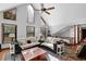 Bright, open living room with vaulted ceilings, a ceiling fan, and cozy seating at 525 Penny Ln, Woodstock, GA 30188