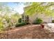 View of backyard and sunroom addition showcasing manicured landscaping and access to the patio at 5628 Harbormist Dr, Powder Springs, GA 30127