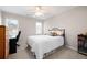 Comfortable bedroom with natural light, a ceiling fan, and space for a desk and bookcase at 5628 Harbormist Dr, Powder Springs, GA 30127