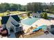 Aerial shot of community pool area and amenities including a clubhouse and playground at 5628 Harbormist Dr, Powder Springs, GA 30127