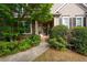 Charming front porch featuring stone accents and a welcoming entrance at 5628 Harbormist Dr, Powder Springs, GA 30127