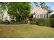 Charming single-story home with manicured lawn, mature landscaping, and inviting front entrance at 5628 Harbormist Dr, Powder Springs, GA 30127