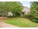 Inviting single-story home with lush front lawn and beautifully landscaped yard at 5628 Harbormist Dr, Powder Springs, GA 30127