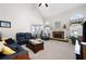 Spacious living room with vaulted ceilings, a stone fireplace, and large windows at 5628 Harbormist Dr, Powder Springs, GA 30127
