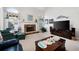 Inviting living room features fireplace, large windows, a ceiling fan, and a comfortable seating arrangement at 5628 Harbormist Dr, Powder Springs, GA 30127