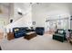 Open-concept living room with soaring ceilings, comfortable seating, and natural light at 5628 Harbormist Dr, Powder Springs, GA 30127