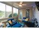 Relaxing sunroom features lots of light, with comfortable seating and view of the outdoors at 5628 Harbormist Dr, Powder Springs, GA 30127