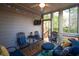 Relaxing sunroom features lots of light, with comfortable seating and a view of the outdoors at 5628 Harbormist Dr, Powder Springs, GA 30127