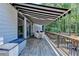 Large back deck with an awning offering shade and comfortable outdoor space at 7020 Grassmoor Grange Way, Cumming, GA 30040