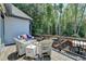 Comfortable deck setting with outdoor furniture and a serene backdrop at 7020 Grassmoor Grange Way, Cumming, GA 30040