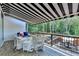 Outdoor back deck with open views of mature trees, perfect for leisure at 7020 Grassmoor Grange Way, Cumming, GA 30040
