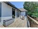 Expansive back deck area with doors leading to the house and yard at 7020 Grassmoor Grange Way, Cumming, GA 30040