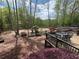Landscaped backyard deck area, perfect for outdoor entertaining at 7020 Grassmoor Grange Way, Cumming, GA 30040