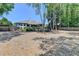 A serene backyard showcasing mature trees, landscaping, and ample room for outdoor living at 7020 Grassmoor Grange Way, Cumming, GA 30040