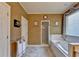 Elegant bathroom with a soaking tub, and separate shower stall in a private area at 7020 Grassmoor Grange Way, Cumming, GA 30040