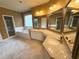 Luxurious bathroom featuring double vanity, large mirrors, and a separate tub and shower at 7020 Grassmoor Grange Way, Cumming, GA 30040