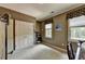 Bedroom with neutral walls, carpet, window, and closet at 7020 Grassmoor Grange Way, Cumming, GA 30040