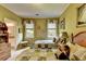 Charming bedroom with twin beds, floral quilts, and cozy decor at 7020 Grassmoor Grange Way, Cumming, GA 30040
