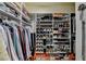 Organized walk-in closet providing ample storage for clothing, shoes, and accessories at 7020 Grassmoor Grange Way, Cumming, GA 30040